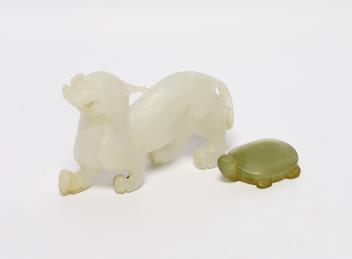 A 19th century Chinese jade model of a lion-dog, 9cm, together with a hardstone ‘tortoise’ pendant